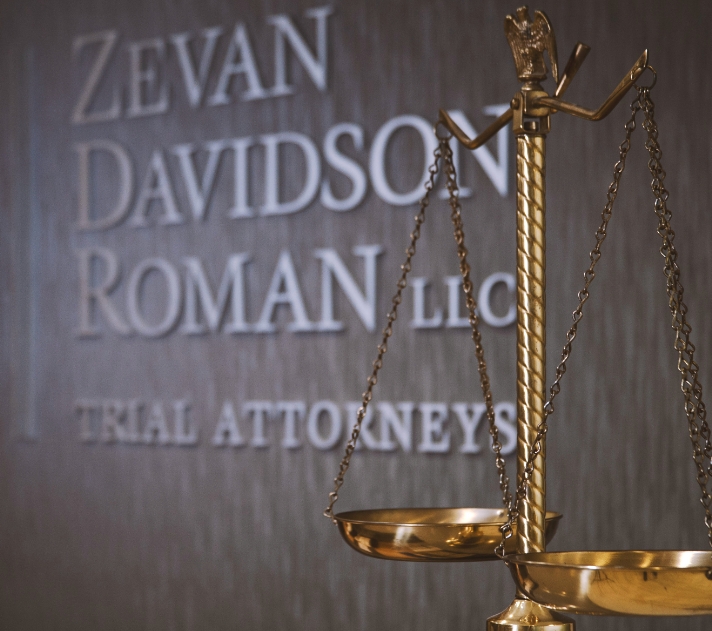 Zevan Davidson Roman Trial Attorneys sign with scales in front of it