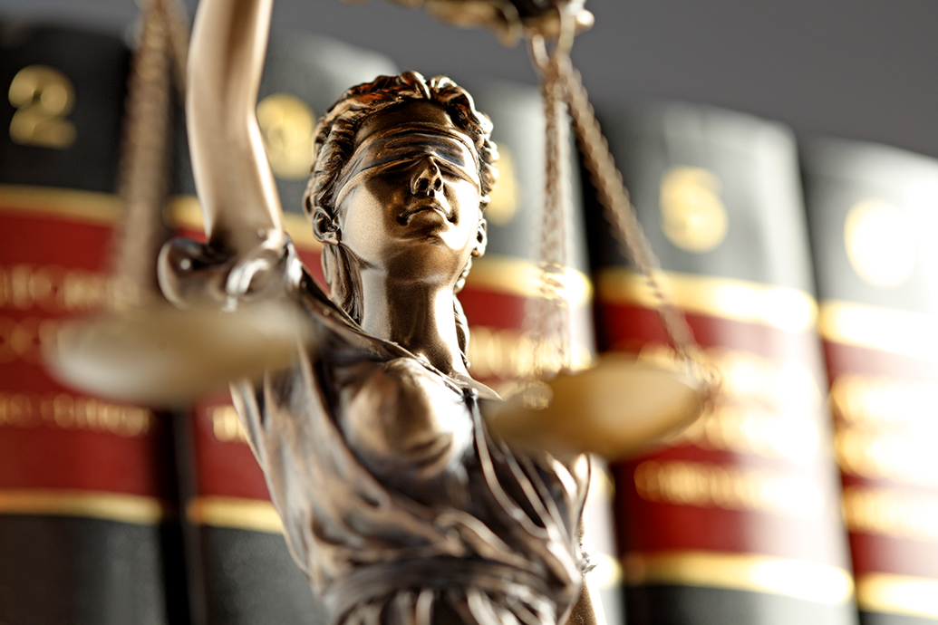 close up image of the bronze legal lady of justice trophy